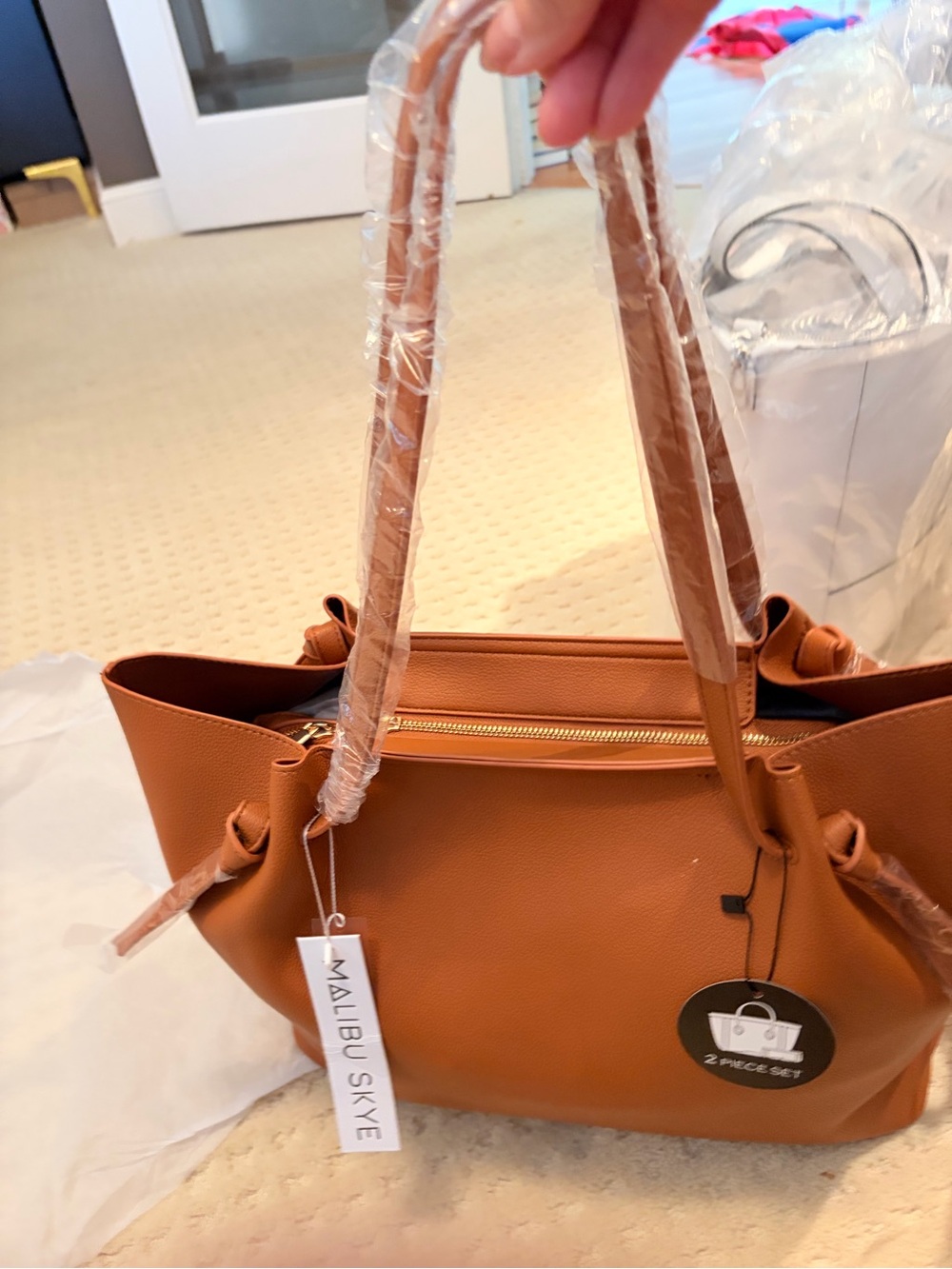 Malibu Tan Pebbled Tote with Gold Zip Accent top & detachable clutch.